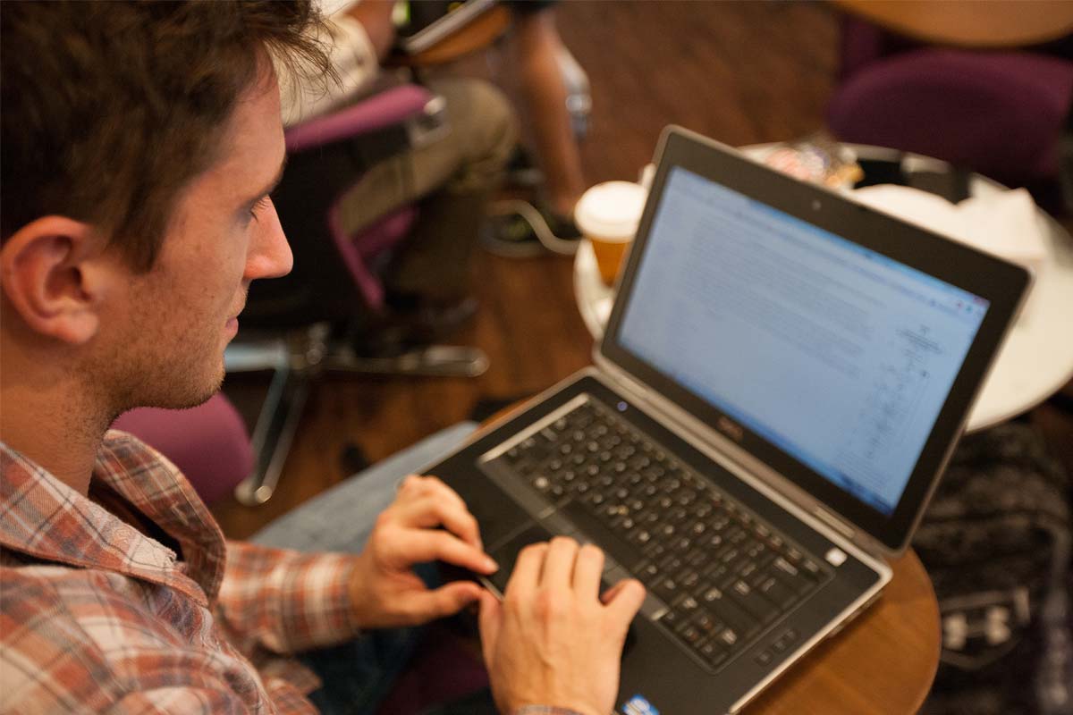 Online student working on laptop